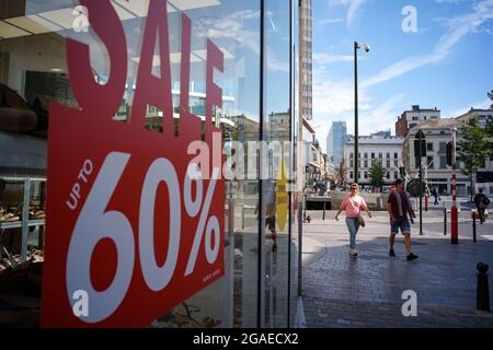 Brussels, Belgium. 30th July, 2021. A sign of sales discount is seen on the window of a shop in Brussels, Belgium, July 30, 2021. In the second quarter 2021, seasonally adjusted GDP increased by 2.0 percent in the euro area and by 1.9 percent in the EU, compared with the previous quarter, according to a preliminary flash estimate published by Eurostat, the statistical office of the European Union. Credit: Zhang Cheng/Xinhua/Alamy Live News Stock Photo