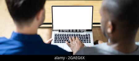 Couple Looking At Empty Laptop Computer Screen Stock Photo