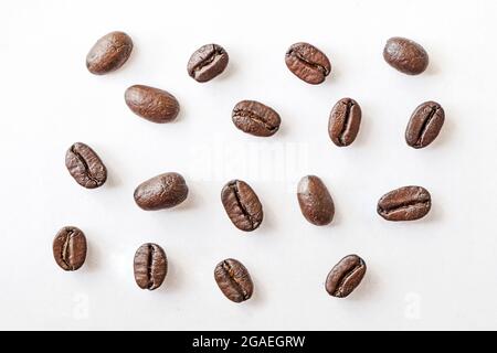 Coffee beans. Isolated on white background. Roasted coffee beans close-up on a white background. macro photo Stock Photo