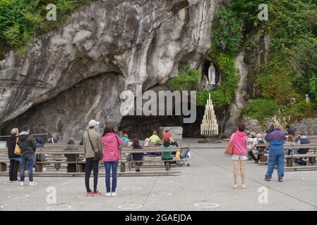 Grotto of Massabielle in the sanctuary of Lourdes, France. Place where the virgin mary appeared to Bernadette Stock Photo