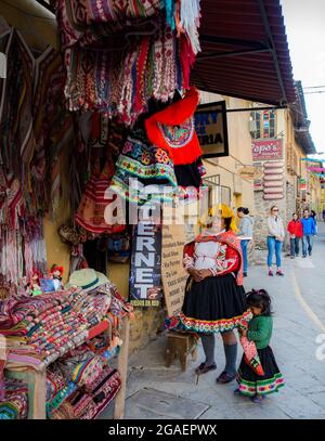 Ollantaytambo, Peru - May,  2016: Quechua woman selling souvenirs in the street. Sacred Valley. South America Stock Photo