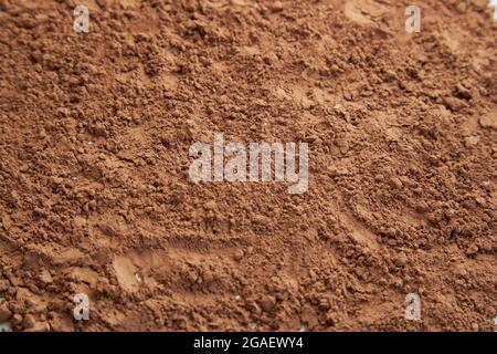 Tasty cocoa powder,texture background. Top view. Stock Photo