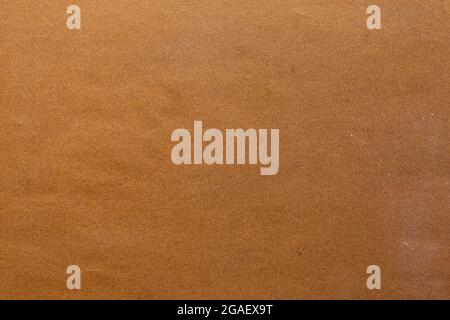 Sandpaper texture background makes the pattern of sand grains on sandpaper look beautiful. It is suitable as background to use in texting because ther Stock Photo
