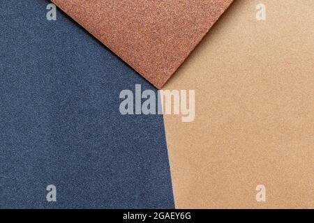 Sandpaper texture background makes the pattern of sand grains on sandpaper look beautiful. It is suitable as background to use in texting because ther Stock Photo