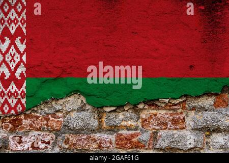 Graphic Concept with a Flag of Belarus painted on a damaged brick wall. Stock Photo