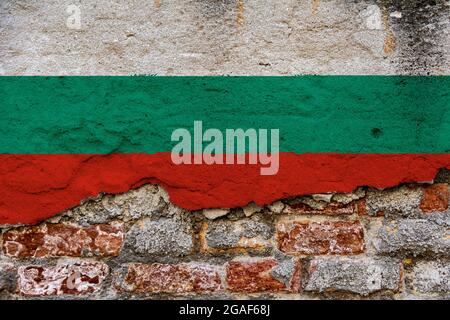 Graphic Concept with a Flag of Bulgaria painted on a damaged brick wall. Stock Photo