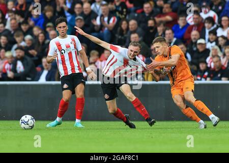 Greg Docherty #8 of Hull City fouls  Carl Winchester #15 of Sunderland Stock Photo