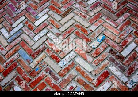 Old bricks are arranged in a herringbone pattern on a wall, July 28, 2021, in Mobile, Alabama. Stock Photo