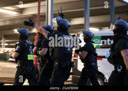 Police officers arrive to detain people following a shooting in Berlin, Germany, July 30, 2021. REUTERS/Christian Mang