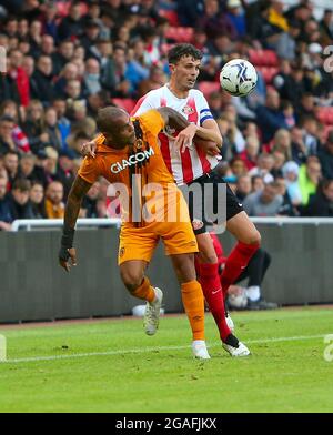 Sunderland, UK. JULY 30TH Hull City's Derick McGuinness battles for the ball with Sunderland's Tom Flanagan during the Pre-season Friendly match between Sunderland and Hull City at the Stadium Of Light, Sunderland on Friday 30th July 2021. (Credit: Michael Driver | MI News) Credit: MI News & Sport /Alamy Live News Stock Photo