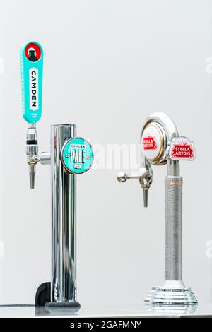 Stella Artois and Camden Town Brewery beer pumps at a Bar Stock Photo