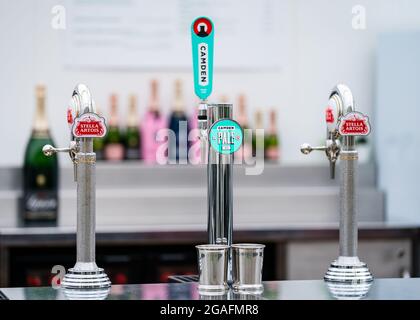 Stella Artois and Camden Town Brewery beer pumps at a Bar Stock Photo