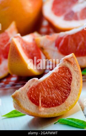 sliced ripe grapefruit on a white background Stock Photo