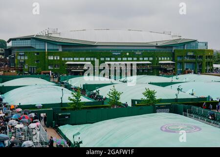 General view of covered courts in the rain during The Wimbledon Championships 2021