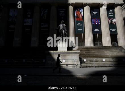 New York, USA. 30th July, 2021. A statue of George Washington stands outside on the steps to Federal Hall after the closing bell at the New York Stock Exchange on Wall Street in New York City on Friday, July 30, 2021. Photo by John Angelillo/UPI Credit: UPI/Alamy Live News Stock Photo