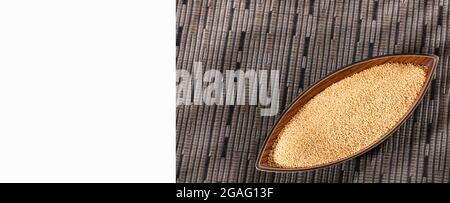 Raw organic amaranth seeds in the wooden bowl - Amaranthus Stock Photo