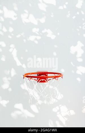 Basketball hoop on a white wall. Isolated. Copy space. Stock Photo