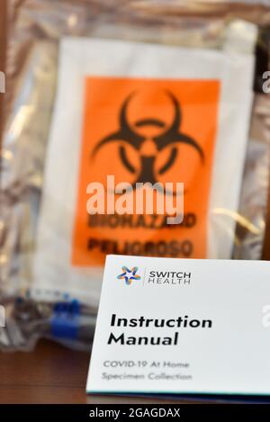 Covid-19 home self-test kit sample in biohazard bag with instruction manual ready to be shipped to Coronavirus testing center, Canada Stock Photo