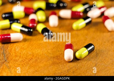 Prescription Drug Capsules On Wood Surface Close-up Stock Photo