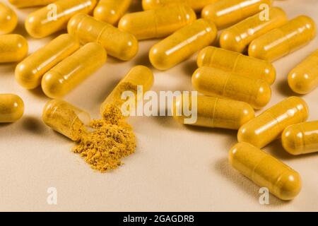 Supplement Drug Capsules With Powder On White Surface Close-up Stock Photo