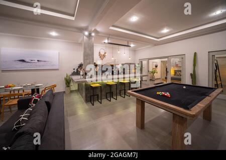Canggu, Bali, Indonesia, 20 October 2019. Modern bedroom interior design for modern life style. Luxury design in living room with billiards. Airy and Stock Photo