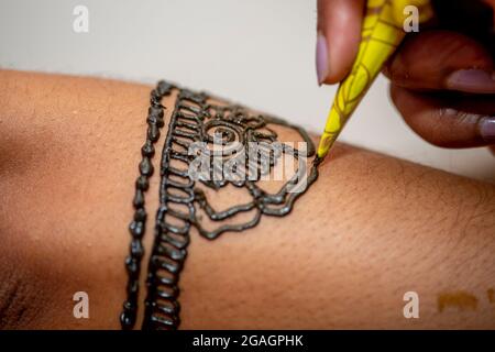 Hindu Bride's hand painted with henna on wedding eve  . Stock Photo