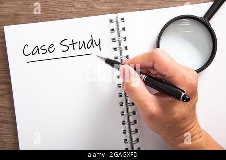 Hand writing a word Case Study on a notebook. Case Study Concept Stock Photo