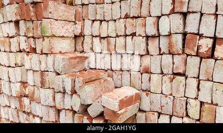 Solid clay red bricks used for construction Stock Photo