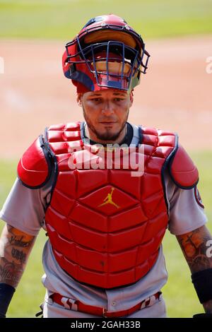 St. Louis Cardinals Yadier Molina checks his hand after being hit by