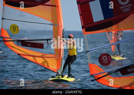 Kanagawa, Japan. 31st July, 2021. Lu Yunxiu of China competes during the women's windsurfer RS:X medal race at the Tokyo 2020 Olympic Games in Kanagawa, Japan, July 31, 2021. Credit: Huang Zongzhi/Xinhua/Alamy Live News Stock Photo