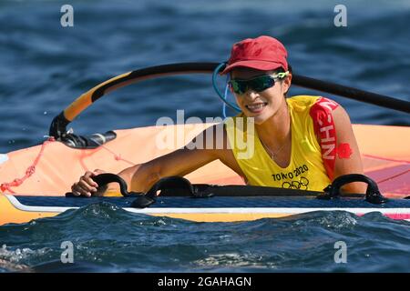 Kanagawa, Japan. 31st July, 2021. Lu Yunxiu of China celebrates after the women's windsurfer RS:X medal race at the Tokyo 2020 Olympic Games in Kanagawa, Japan, July 31, 2021. Credit: Huang Zongzhi/Xinhua/Alamy Live News Stock Photo