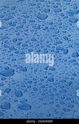 Drops of water on blue surface Stock Photo