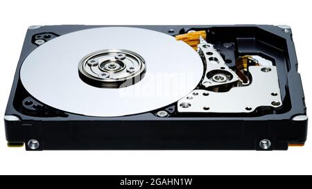 a computer's hard disk hdd data storage drive without shield show magnetic disc and electronic part inside isolated  in white background Stock Photo