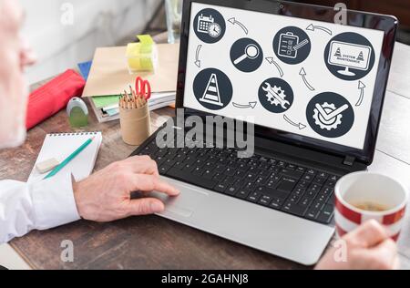 System maintenance concept shown on a laptop screen Stock Photo