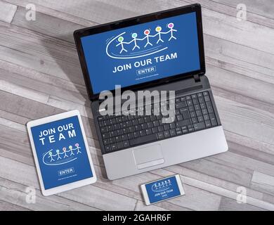 Join our team concept shown on different information technology devices Stock Photo