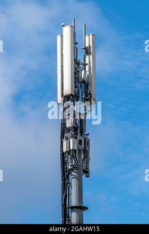 mobile telecommunications mast, telecomms aerials, telecommunications transmitter, smartphone networks, 4 g network, modern telecommunications mast. Stock Photo