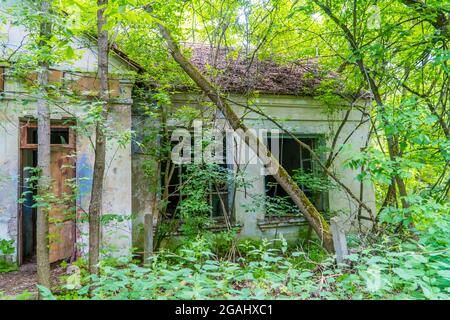 Abandoned decaying Soviet buildings in the city of Pripyat, Ukraine - evacuated after the Chernobyl disaster Stock Photo