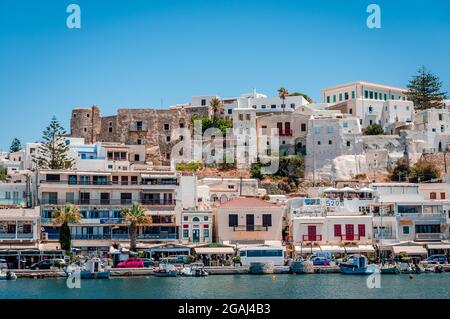 Naxos, Greece - July 23 2016: View of the waterfront and the town, with the old Venetian castle. Stock Photo