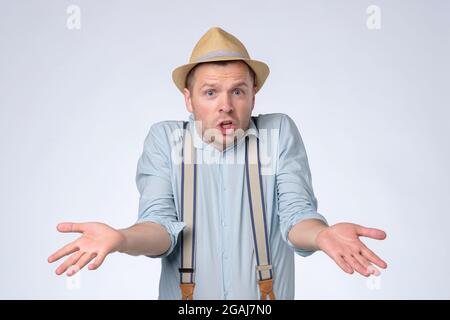 man with angry facial expression asking so what do you want from me. Stock Photo