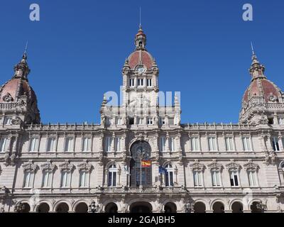 Facade of city hall building on main square in european A Coruna city at Galicia in Spain, clear blue sky in 2019 warm sunny summer day on September. Stock Photo