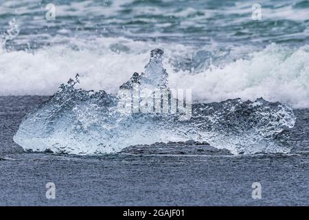 Melting ice block on Diamond Beach, Jokulsarlon, Iceland Stock Photo