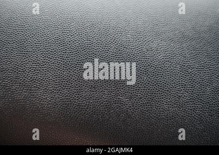 Car dashboard texture . Close up black leather and texture background. Soft focus Stock Photo