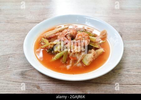 boiled mixed vegetable topping shrimp Thai spicy soup on plate Stock Photo