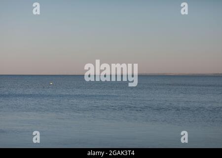 ocean close-up with transparent water on the sandy shore Stock Photo