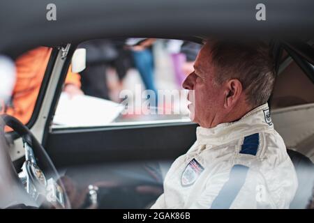 Towcester, Northamptonshire, UK. 31st July, 2021. Martin Brundle (ENG) TV commentator gets ready in his Jaguar E-Type during The Classic Motor Racing Festival at Silverstone Circuit (Photo by Gergo Toth / Alamy Live News) Stock Photo