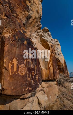 Spectacular panel of stylized human figures at McKee Spring Petroglyph Site, Dinosaur National Monument, Utah, USA Stock Photo