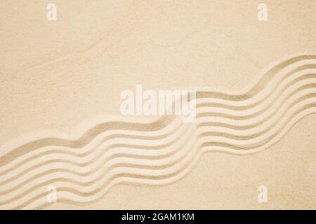 Sea sand with waves background. Top view. Flat lay Stock Photo