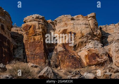 Spectacular panel of stylized human figures at McKee Spring Petroglyph Site, Dinosaur National Monument, Utah, USA Stock Photo