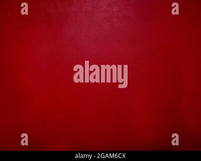 Dark red leather background with empty copy space. Dark red leather texture. Stock Photo