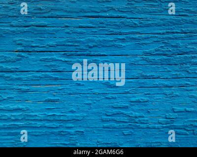 Texture of old paint on the wooden surface. Background of cracked blue paint, close-up Stock Photo